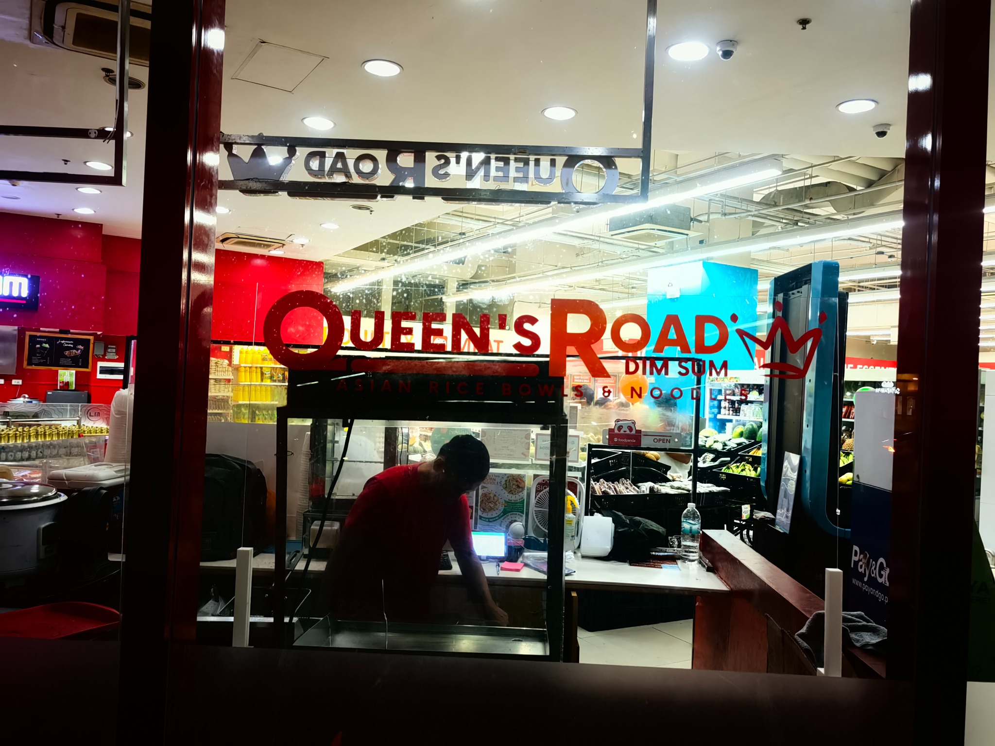 Queen's Road sticker branding and storefront graphics project by Sky Graphix Digital Solutions